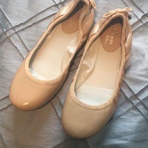 Tan or beige patten leather Cole haan flats